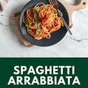 Pinterest pin showing spaghetti arrabbiata with a green text box displaying the name of the recipe and the URL for Two Cloves Kitchen.