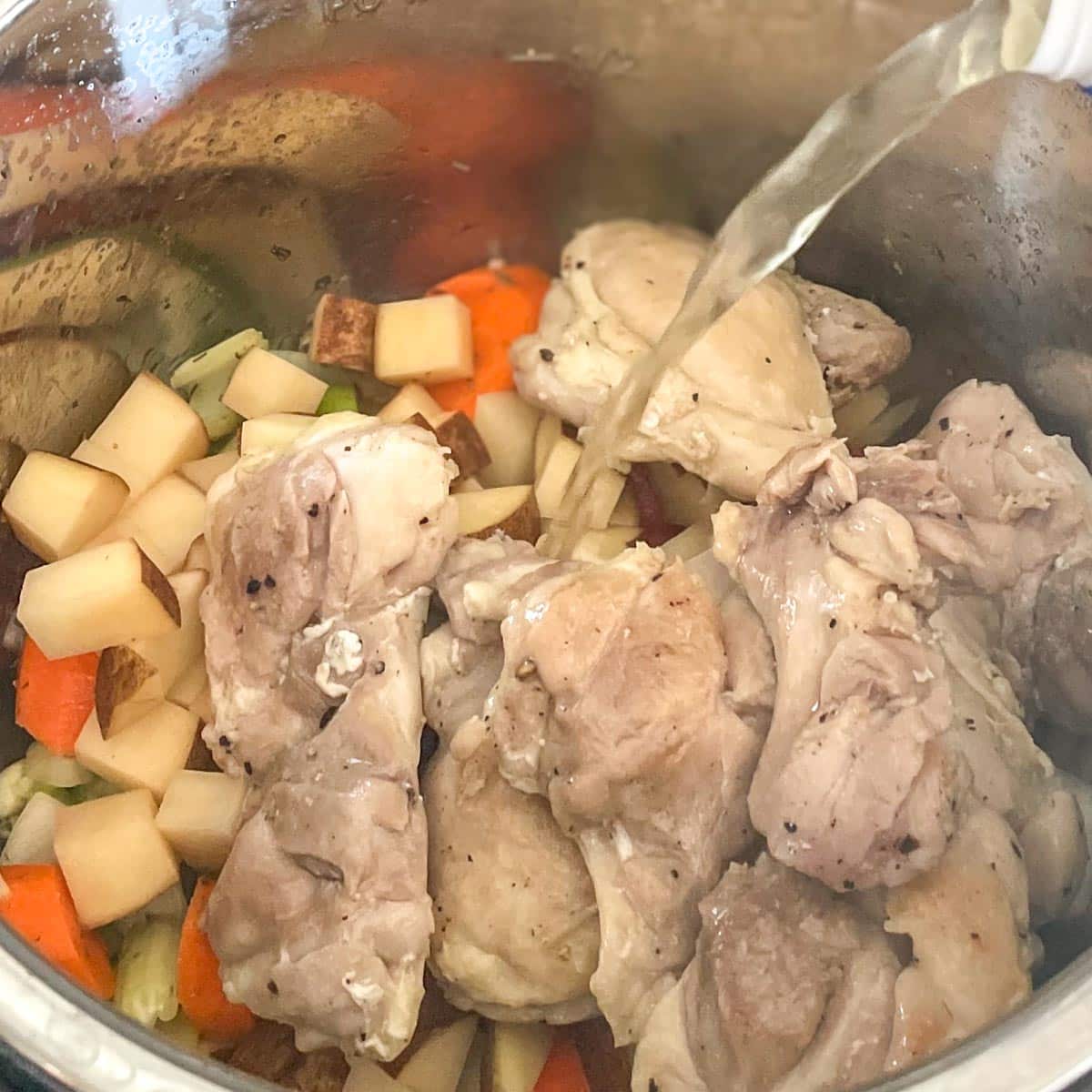 Broth is added to the stew.