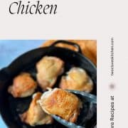 A golden brown chicken thigh is held with tongs in the foreground above a cast iron pan of chicken thighs with the words Cast Iron Chicken and the URL www.twocloveskitchen.com.