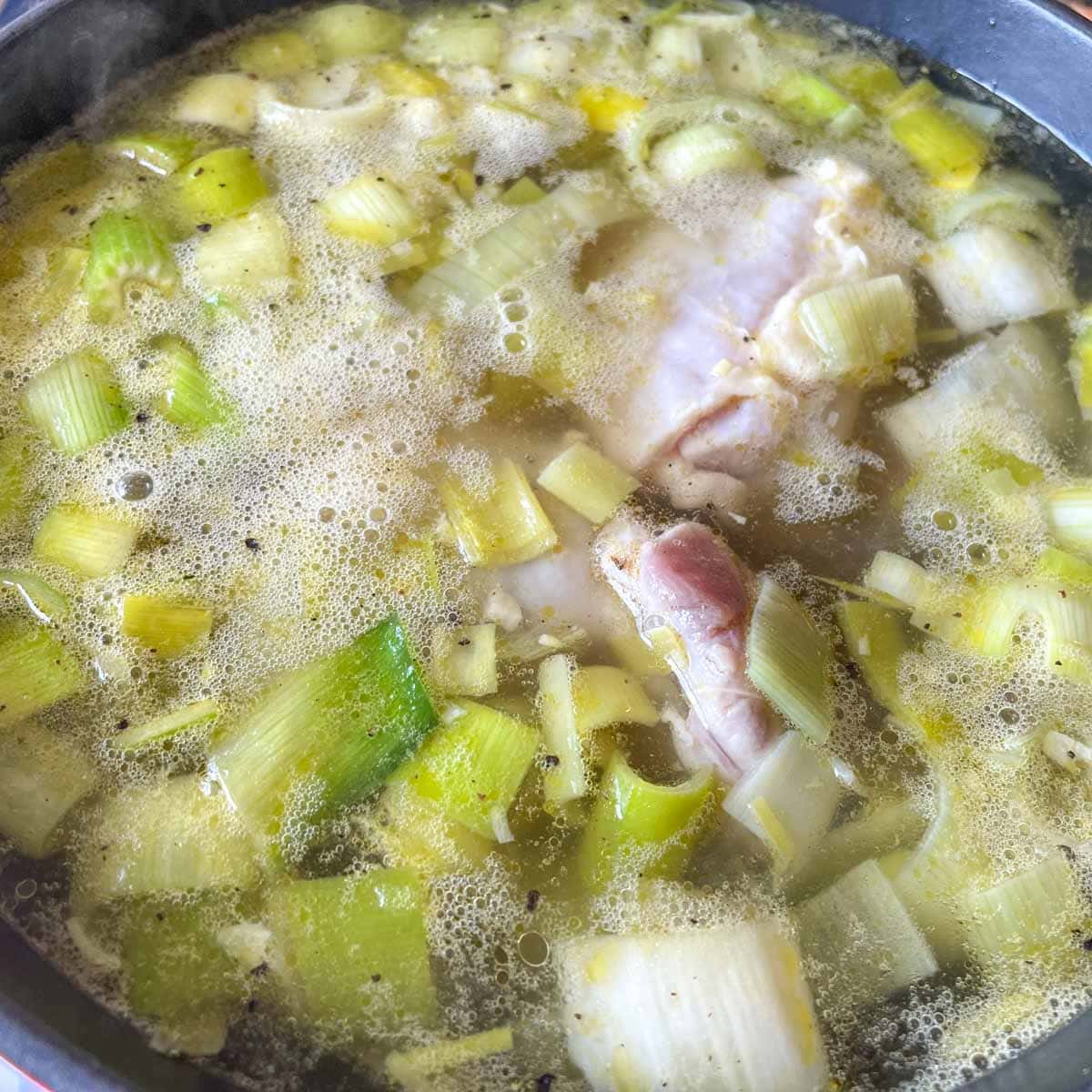 Chicken is added to the soup.