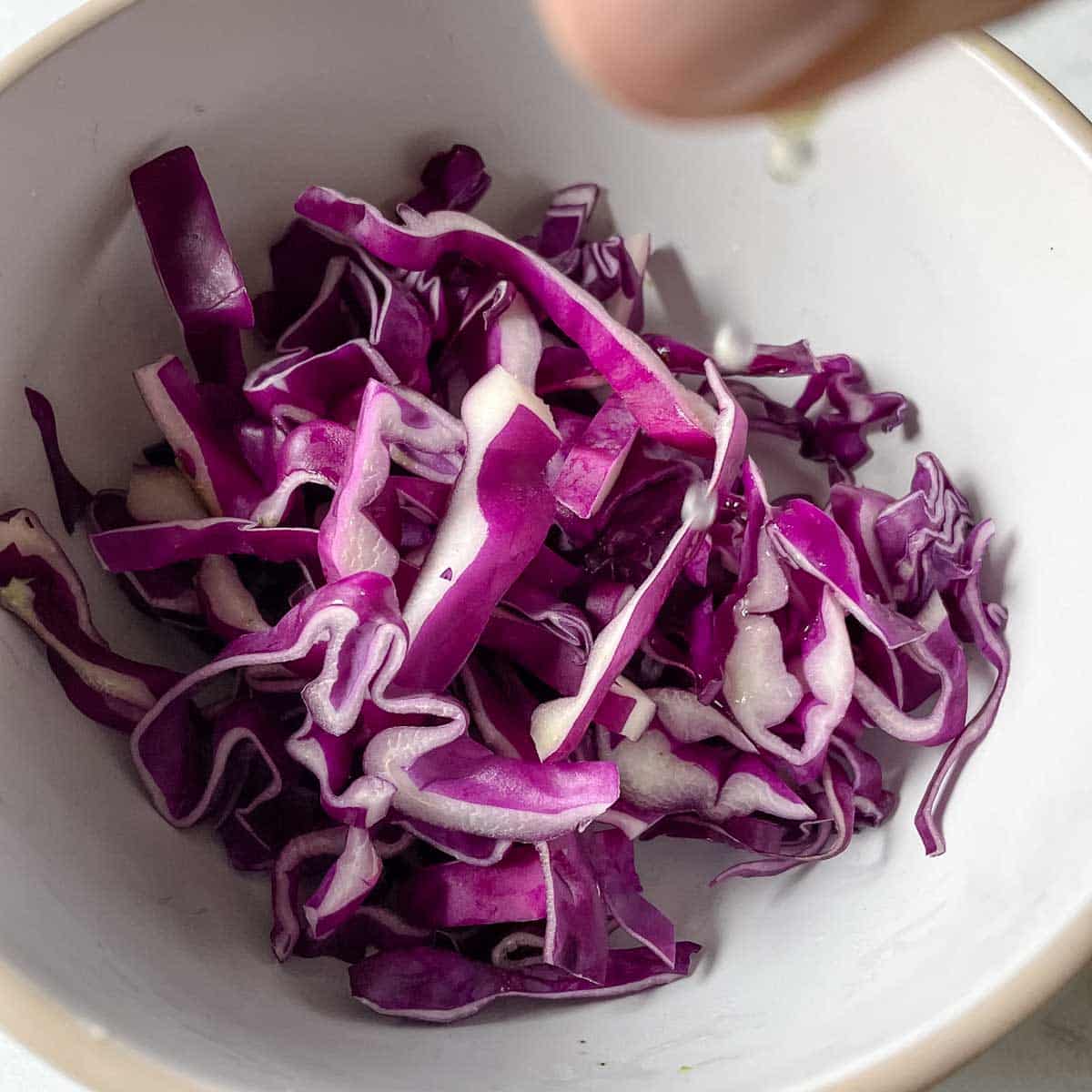 Red Cabbage is dressed with lime juice.