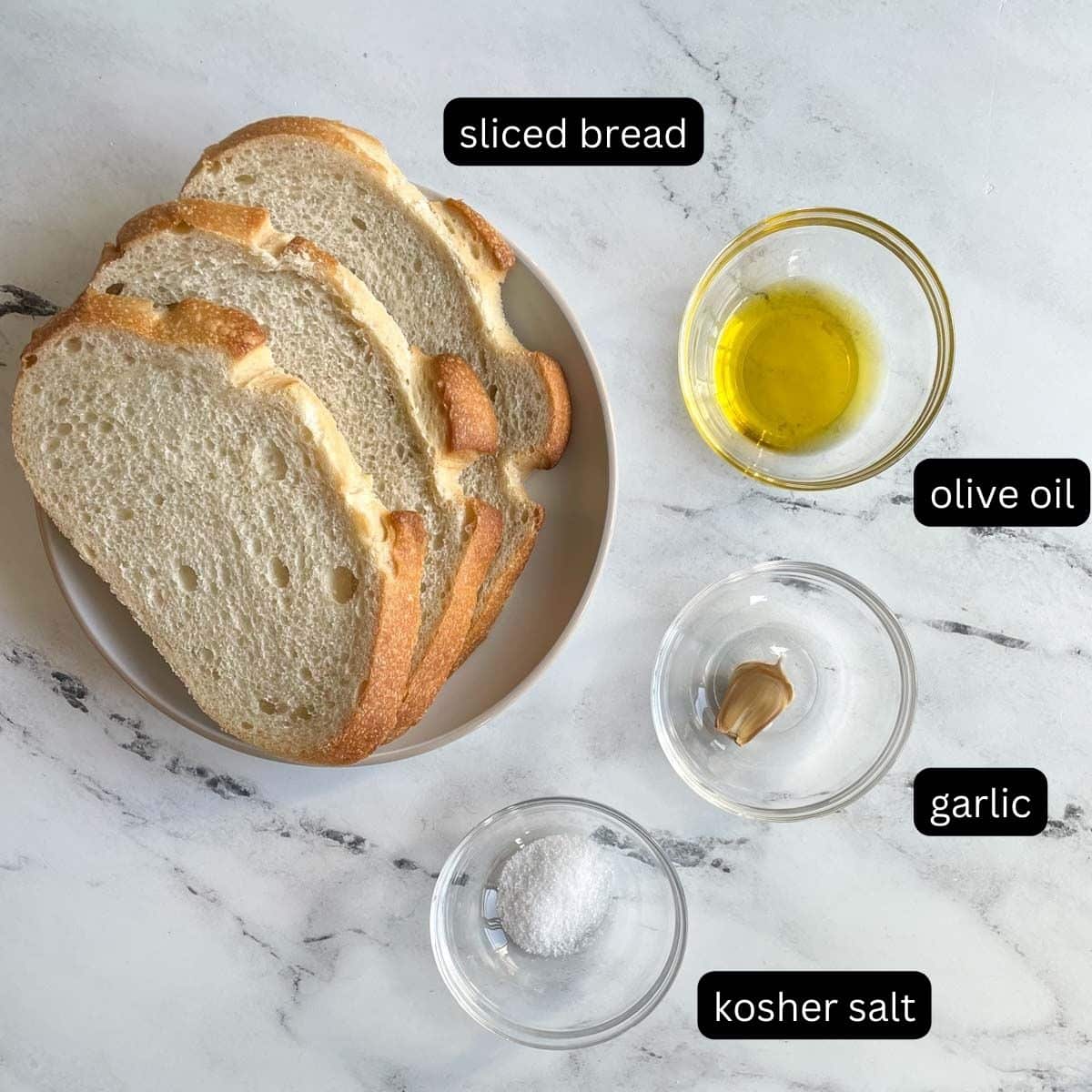 The labeled ingredients for Air Fryer Toast are shown on a white marble counter.