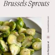 This Pinterest pin shows marinated brussels sprouts in a white bowl with the words marinated brussels sprouts and the URL www.twocloveskitchen.com.