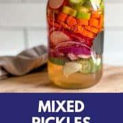 Pinterest pin showing a Mason jar filled with mixed pickles with the title Mixed Pickles and the URL www.twocloveskitchen.com.