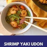A bowl of shrimp yaki udon is shown with the words Shrimp Yaki Udon and the URL www.twocloveskitchen.com.