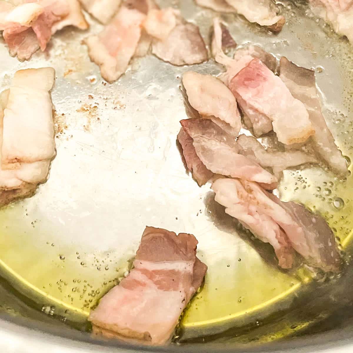 Chopped bacon is rendered in the Instant Pot.