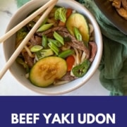 A bowl of beef yaki udon is shown with the words Beef Yaki Udon and the URL www.twocloveskitchen.com.