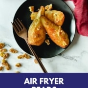 An image of air fryer pears sit on a black plate are shown with the URL www.twocloveskitchen.com.