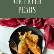 An image of air fryer pears sit on a black plate are shown with the URL www.twocloveskitchen.com.