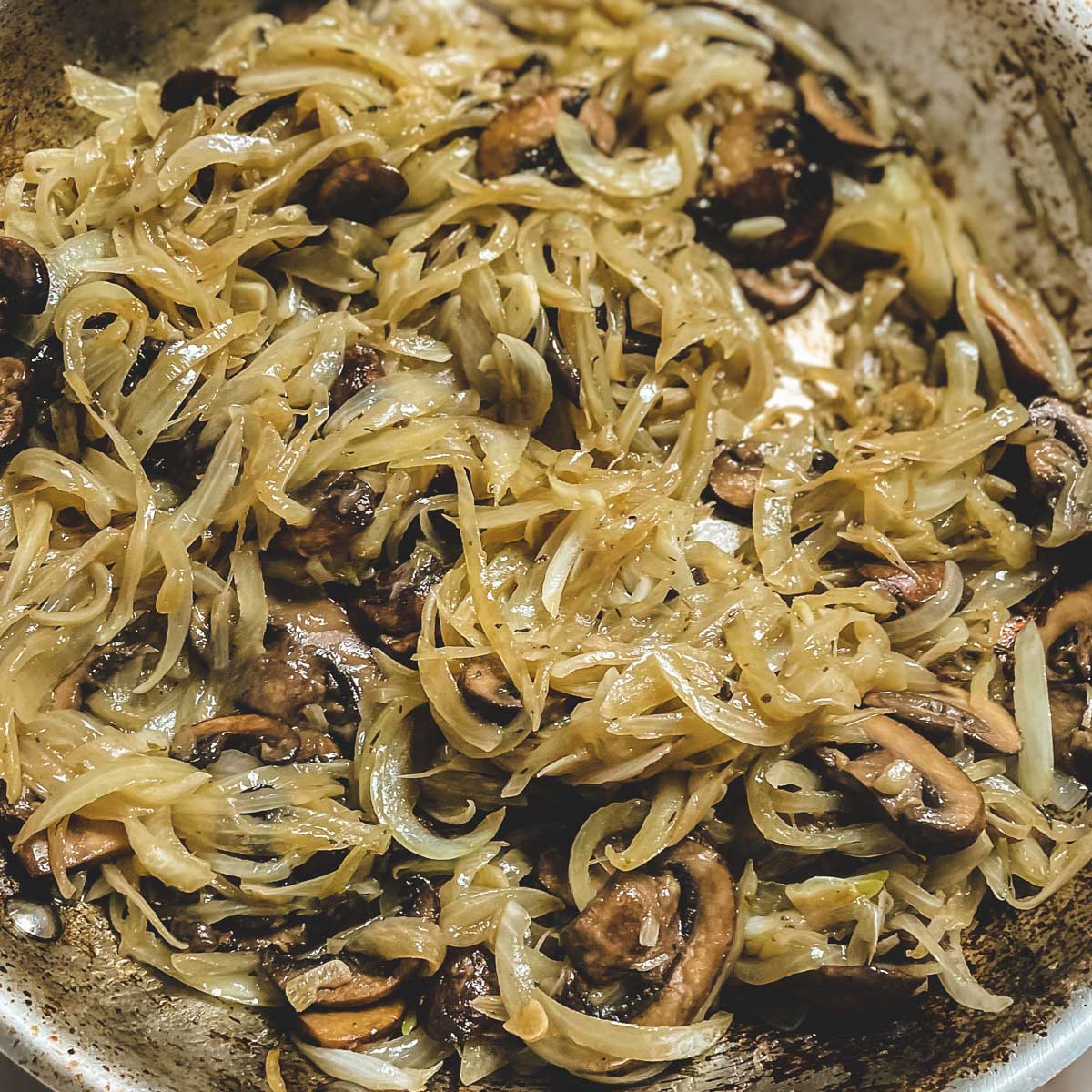 The mushrooms and onions are shown after 30 minutes and they are a light golden color and soft.