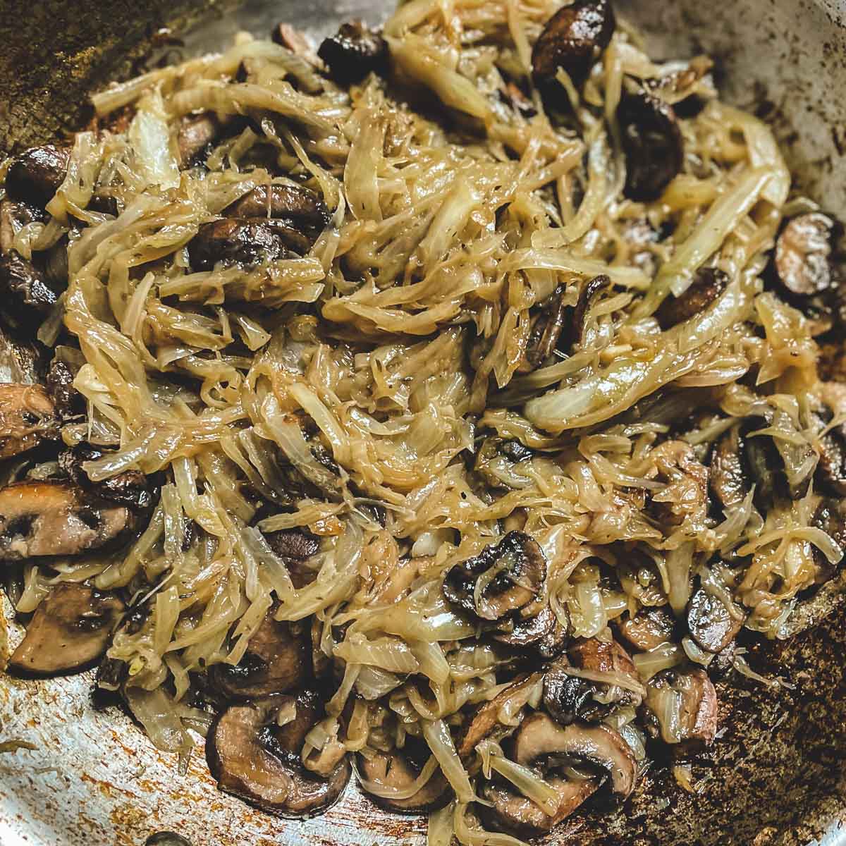 The finished caramelized onions and mushrooms are now deeply browned and softened.