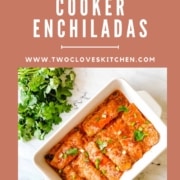 Enchiladas are shown in a baking dish with the words Chicken Slow Cooker Enchiladas are the URL www.twocloveskitchen.com.