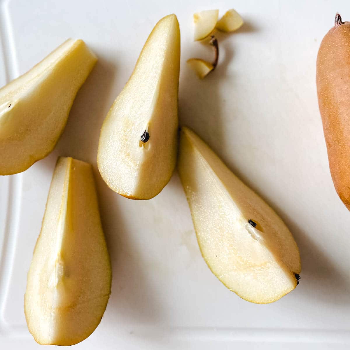 Pears are sliced into wedges.