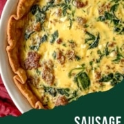 A closeup of a quiche is shown with the words Sausage Spinach Quiche and the URL www.twocloveskitchen.com.