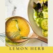 Homemade dressing in a spoon is shown with the words Lemon Herb Vinaigrette and the URL www.twocloveskitchen.com.