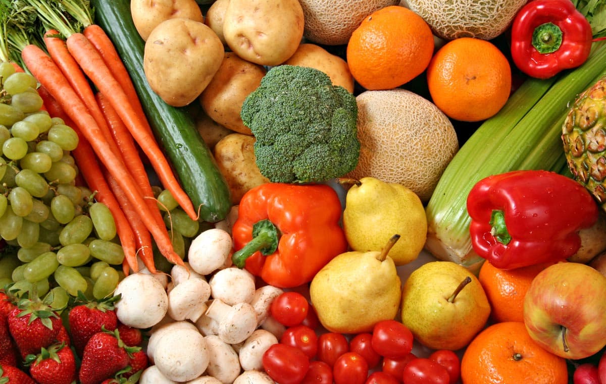 A colorful mixture of different fruits and vegetables are shown.