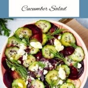 beet cucumber salad in a pink dish with the words beet cucumber salad and the URL www.twocloveskitchen.com.