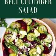 beet cucumber salad in a pink dish with the words beet cucumber salad and the URL www.twocloveskitchen.com.