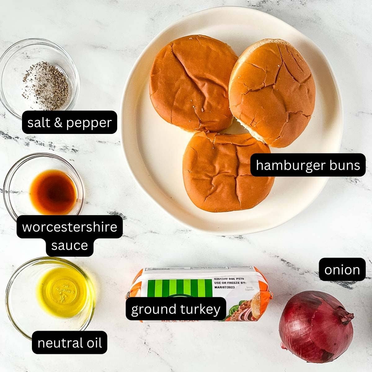 The labeled ingredients for turkey smash burgers on a white marble counter.