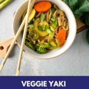 A bowl of vegetable yaki udon is shown with the words Veggie Yaki Udon and the URL www.twocloveskitchen.com.