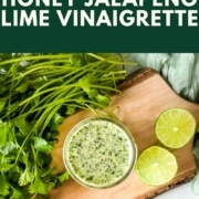 A jar of green vinaigrette is shown with the words honey lime jalapeno vinaigrette and the URL www.twocloveskitchen.com.