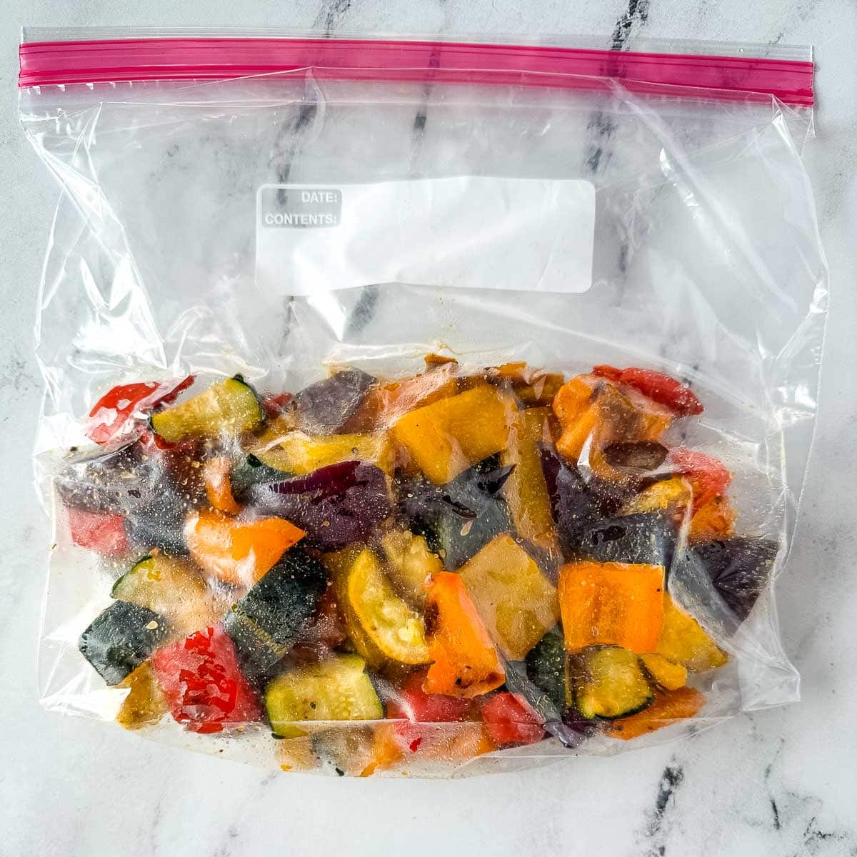 Frozen roasted vegetables in a resealable plastic bag.
