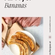 Air fried bananas on a white plate with the text air fryer bananas and the URL for two cloves kitchen dot com.