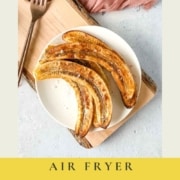 Air fried bananas on a white plate with the text air fryer bananas and the URL for two cloves kitchen dot com.