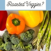 A closeup shot of colorful fresh vegetables with the words Can you freeze roasted vegetables and the URL for two cloves kitchen dot com.