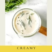 dill sauce in a small glass container with the words creamy dill sauce and the URL for two cloves kitchen dot com.
