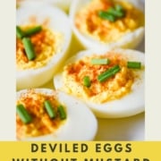 Closeup shot of deviled eggs with the words Deviled Eggs without Mustard and the URL for two cloves kitchen dot com.
