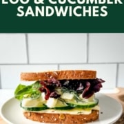 an egg and cucumber sandwich is shown with the words egg and cucumber sandwiches and the URL for two cloves kitchen dot com.