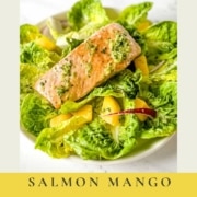 A plate of salmon mango salad with the words salmon mango salad and the URL for two cloves kitchen dot com.