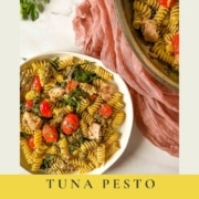 A plate of tuna pesto pasta next to a pan of pasta with the words Tuna pesto pasta and the URL for two cloves kitchen dot com.