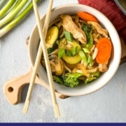 chicken stir-fry in a bowl with the words chicken yaki udon and the URL two cloves kitchen dot com.