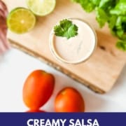 Creamy salsa dressing on a wooden cutting board with the words Creamy Salsa Dressing and the web address for two cloves kitchen dot com.