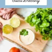 Creamy salsa dressing in a glass jar with the words Creamy Salsa Dressing and the web address for two cloves kitchen dot com.
