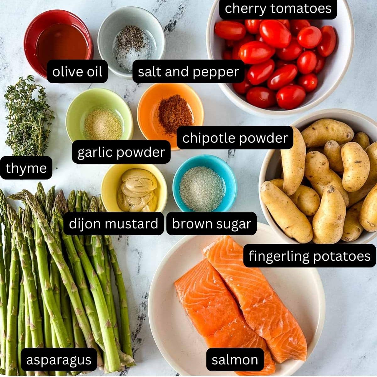 labeled ingredients for sheet pan salmon and veggies.