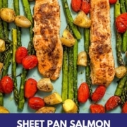 Closeup shot of roasted salmon and vegetables with the words sheet pan salmon and veggies and the web address two cloves kitchen dot com.