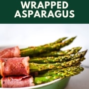 brushing turkey bacon wrapped asparagus bundles with the words turkey bacon wrapped asparagus and the URL two cloves kitchen dot com.