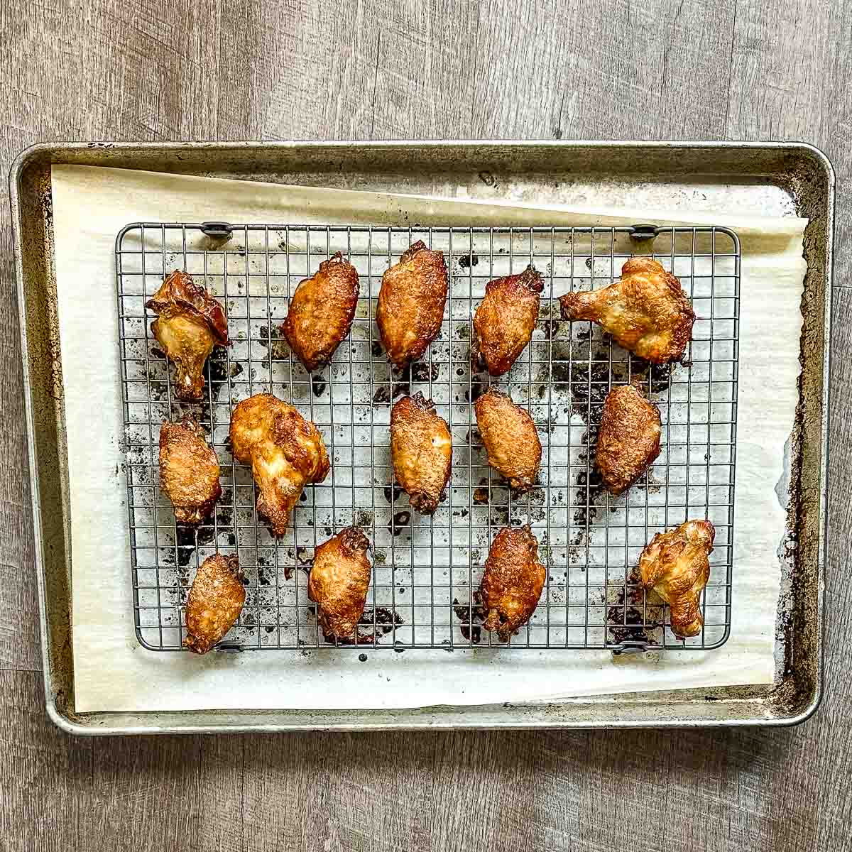 Baked soy garlic wings on a sheet tray.