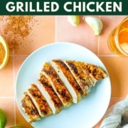 An image of grilled, sliced chicken with the words Tajín Grilled Chicken and the web address two cloves kitchen dot com.