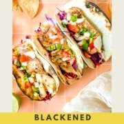 Fish tacos on a peach tile background with the word blacked fish tacos and the web address for two cloves kitchen dot com.