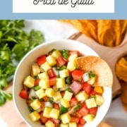 An image is shown with a bowl of pineapple salsa, the words pineapple pico de gallo, and the web address for two cloves kitchen dot com.