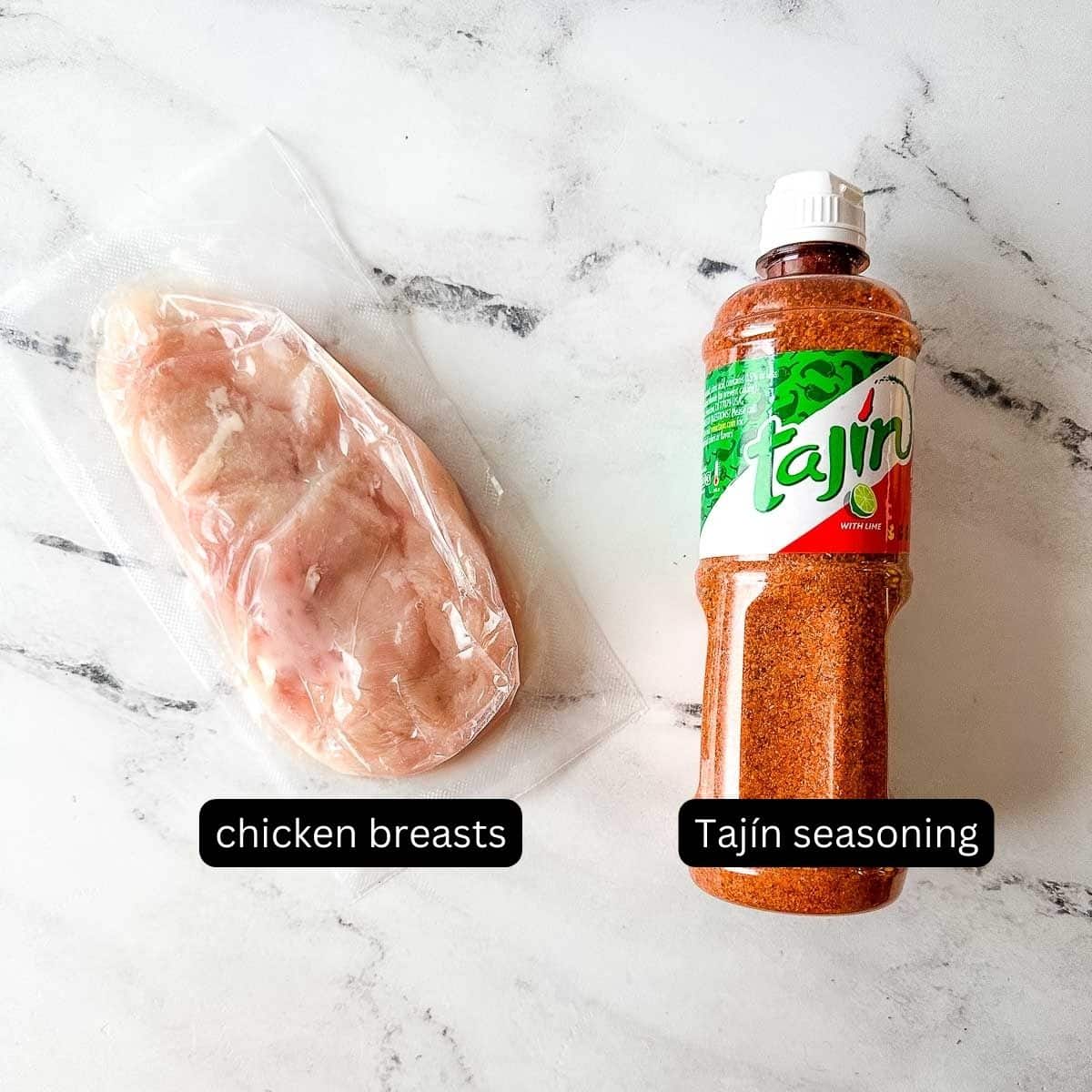 The labeled ingredients for Tajin Grilled Chicken sit on a white marble counter.
