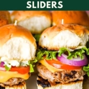 An image fo turkey burger sliders with the text Turkey Burger Sliders and the web address two cloves kitchen dot com.