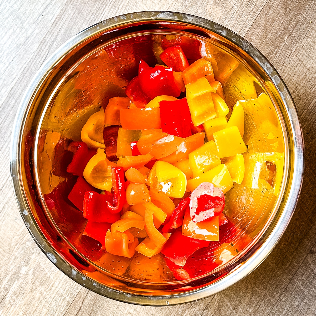 Cut bell peppers in bowl tossed in olive oil, salt and pepper.