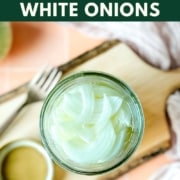 Image shows pickled white onions in a jar with the words quick pickled white onions and the web address two cloves kitchen dot com.