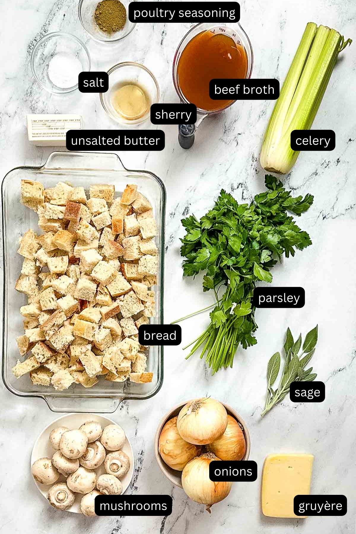 Labeled ingredients for French onion stuffing on a marble counter.