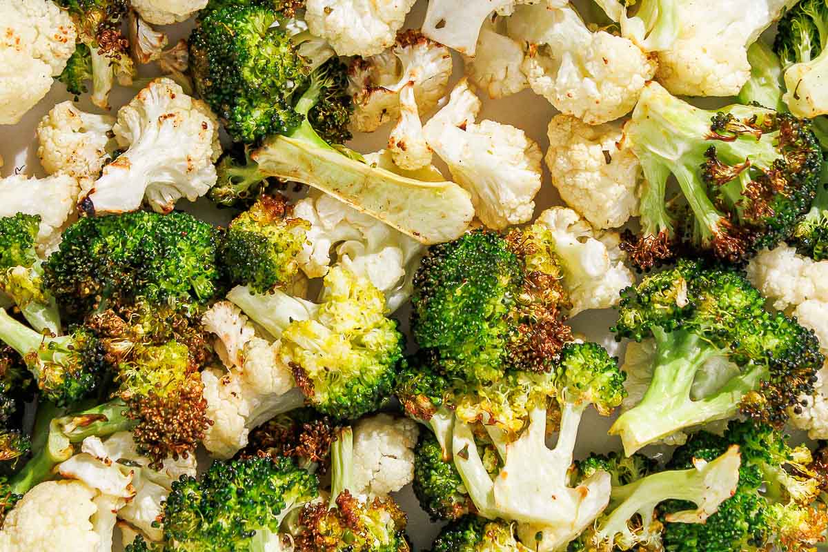 A close up of air fryer broccoli and cauliflower.